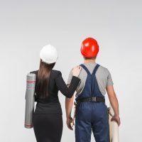 woman-engineer-standing-with-builder
